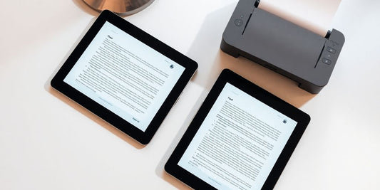 iPad, printer, and paper on a clean desk.