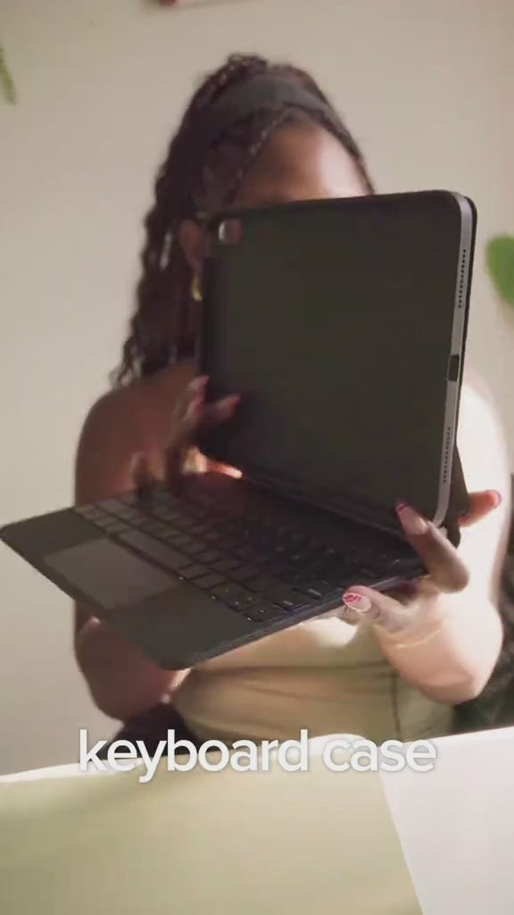 Creator showcasing the CHESONA Cloud 2 black iPad keyboard case in a close-up product demonstration.